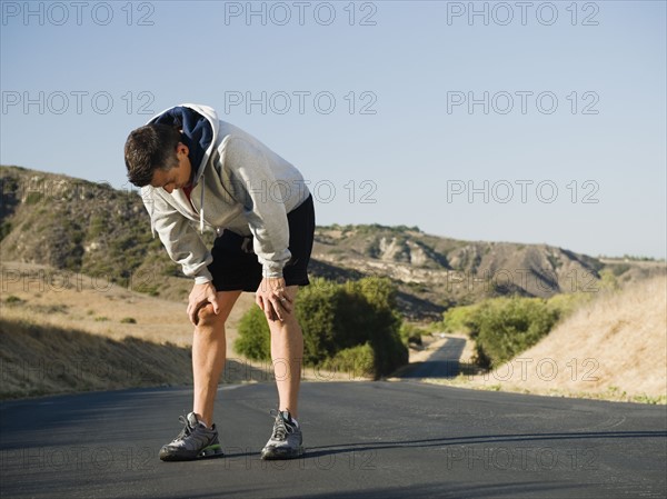 Male jogger resting