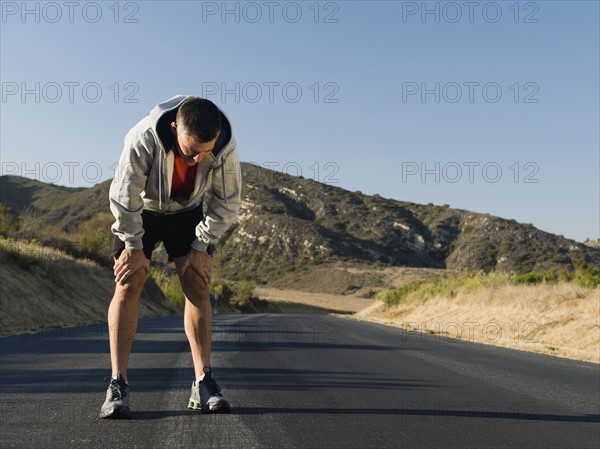 Male jogger resting