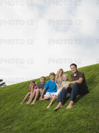 Family sitting on grass