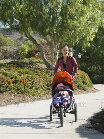 Woman jogging with stroller