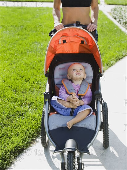 Woman jogging with stroller