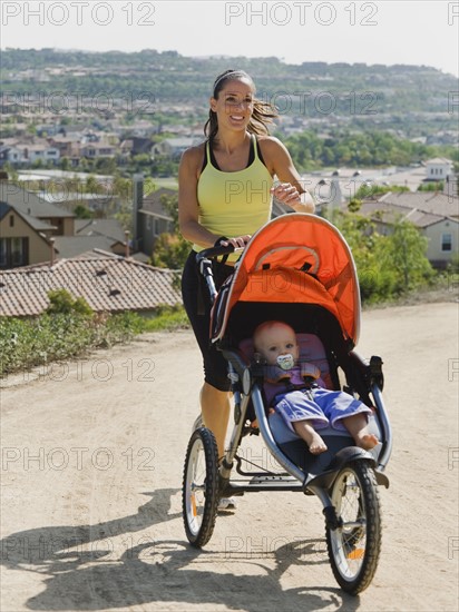 Woman jogging with stroller