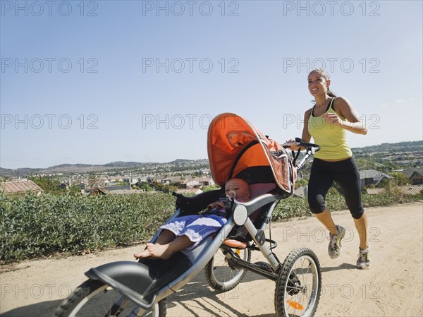 Woman jogging with stroller