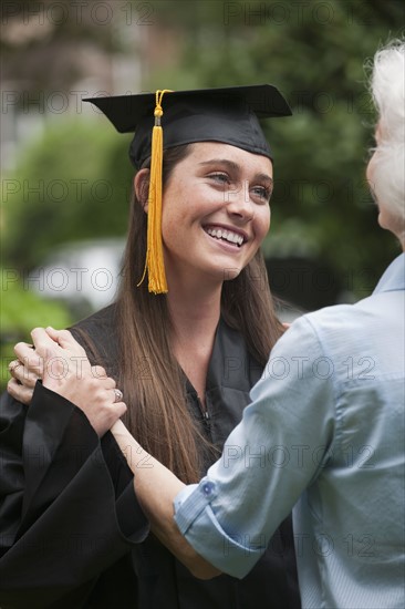 Graduate and elderly woman