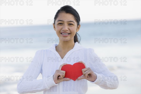 Girl holding heart