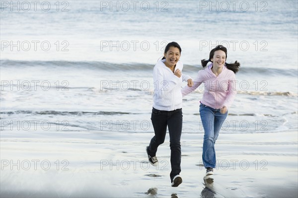 Girls running on beach