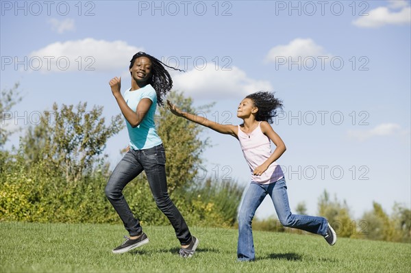 Woman and girl running