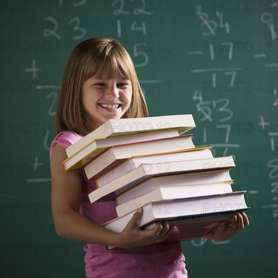 Young student holding books