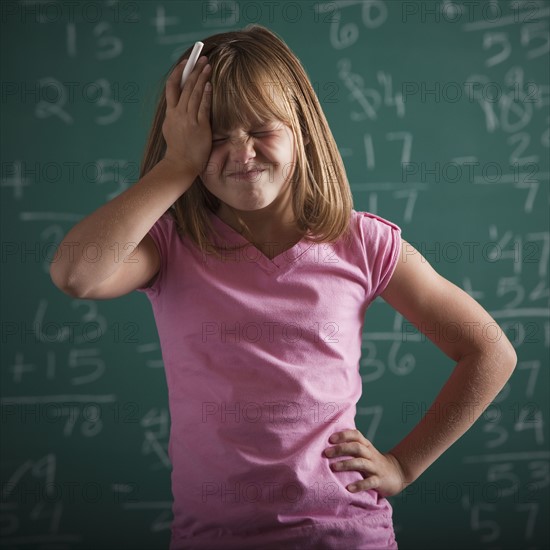 Student in front of chalkboard