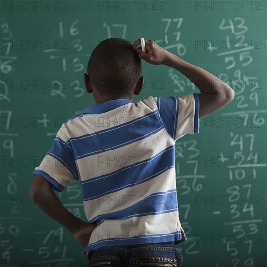 Student in front of chalkboard