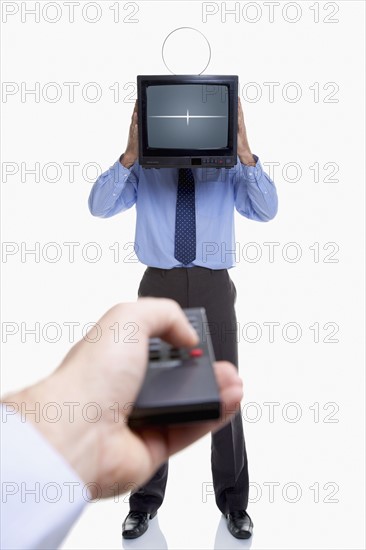 Man holding television and remote