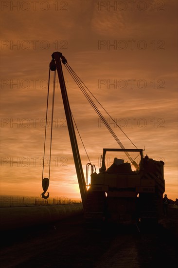 Heavy equipment at sunset