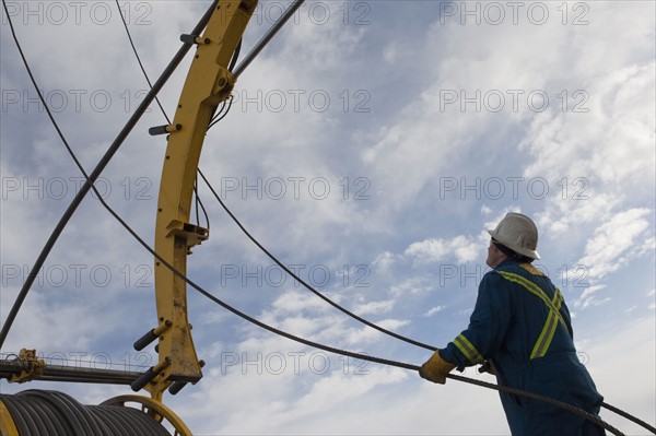 Man working with drilling equipment