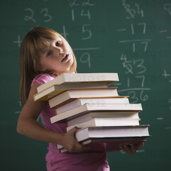 Young student holding books