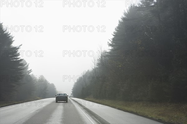 Car driving on rural road