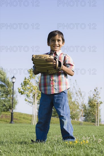 Boy wearing baseball glove