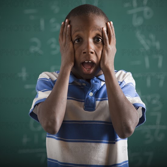 Student in front of chalkboard