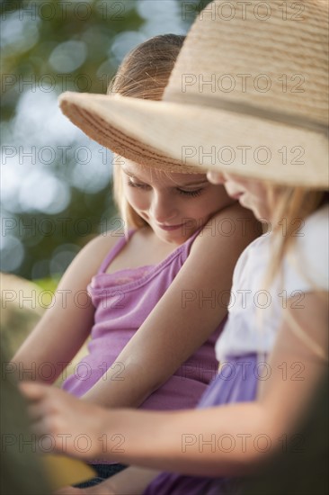 Girls reading outside