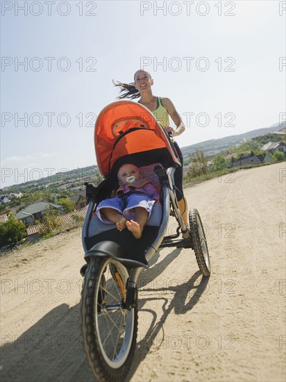 Woman jogging with stroller