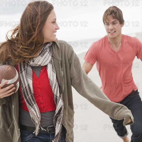 Couple playing football