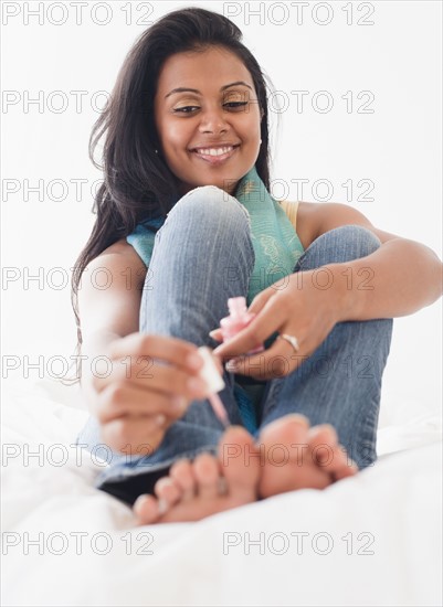 Woman painting toe nails