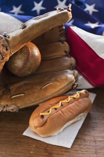 Baseball glove hotdog and American flag.