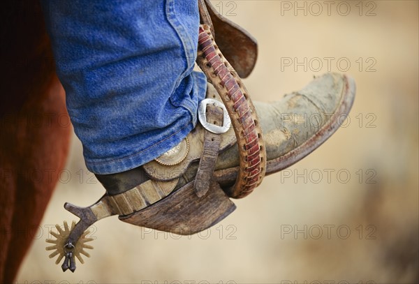 Cowboy boot with spur.