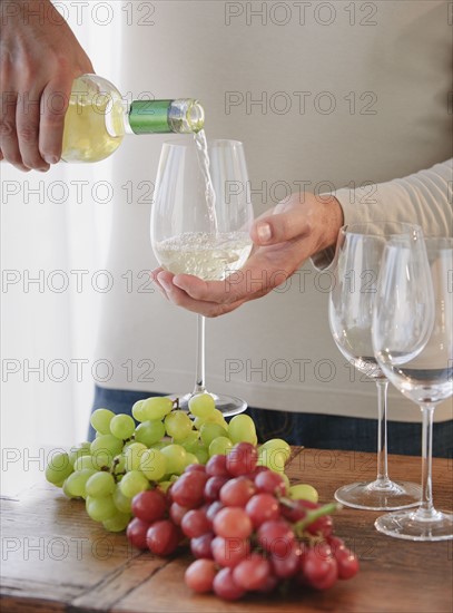 Pouring wine.