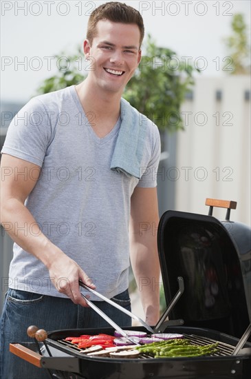 Man barbequing.