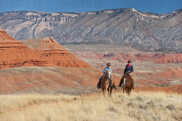 Horseback riders.