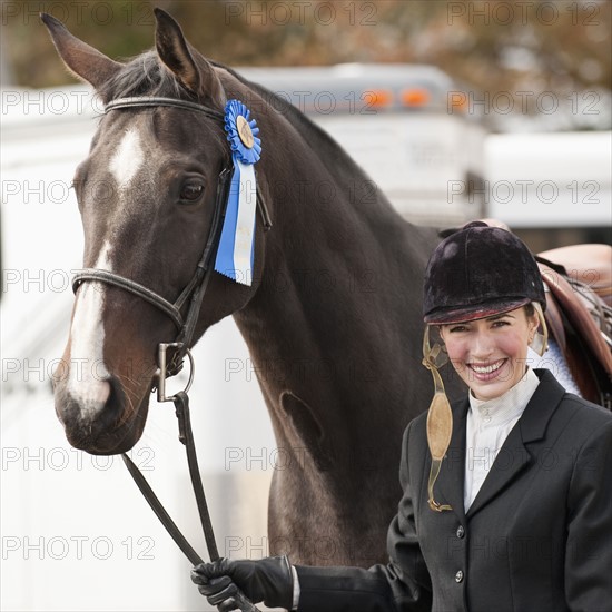 Horse wearing ribbon.