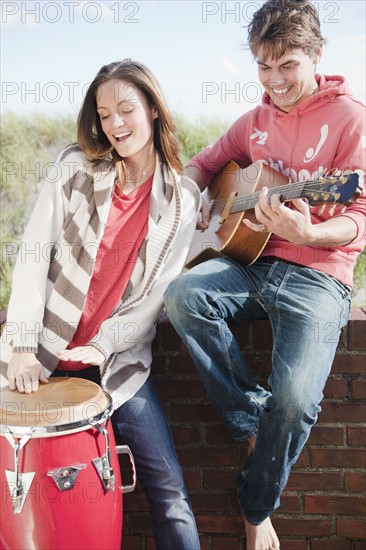Couple playing instruments