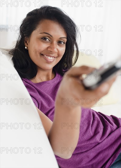 Woman holding remote control