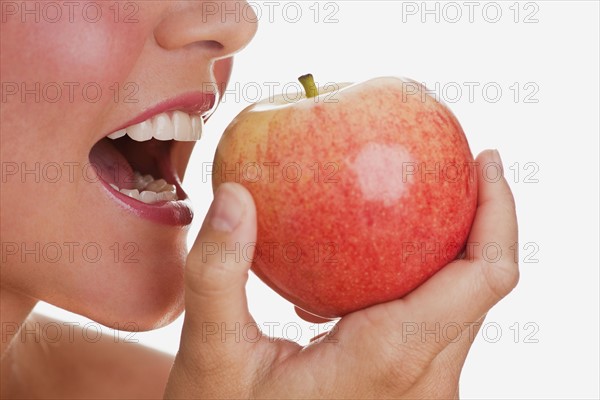 Woman eating apple