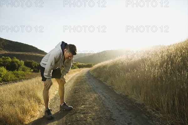 Male jogger resting