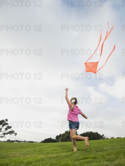 Girl flying a kite