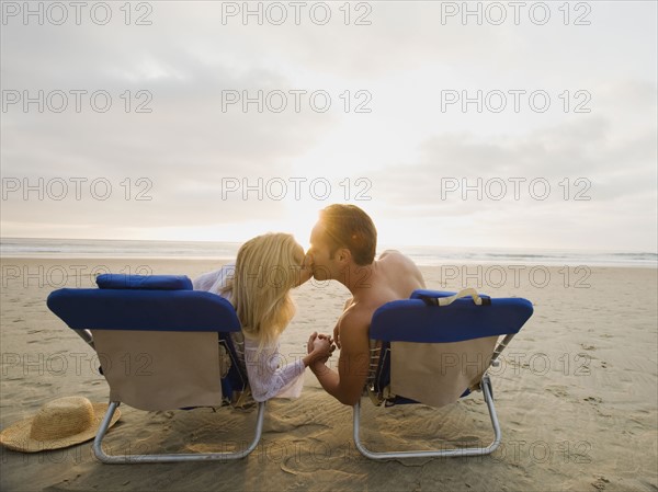 Couple kissing at the beach