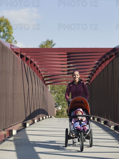 Woman pushing stroller