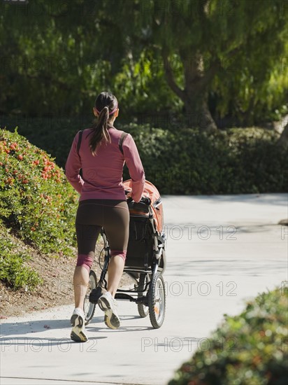 Woman jogging with stroller