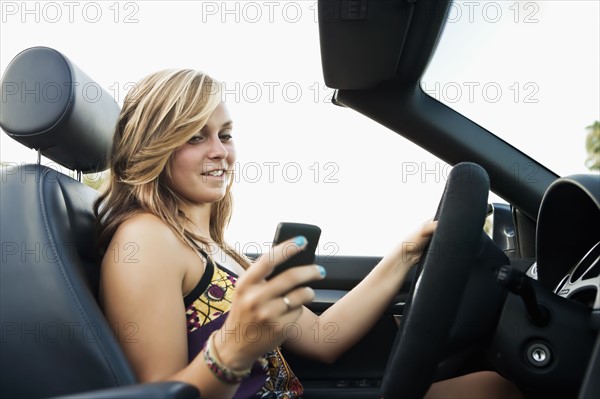 Woman driving convertible