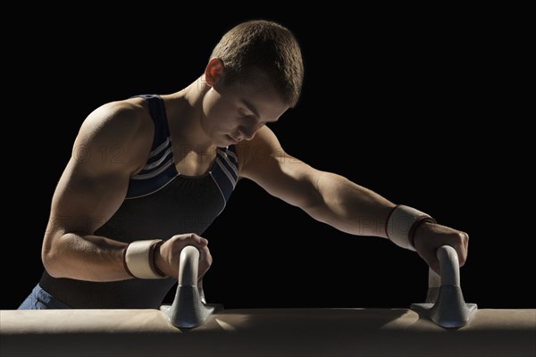 Male gymnast stretching