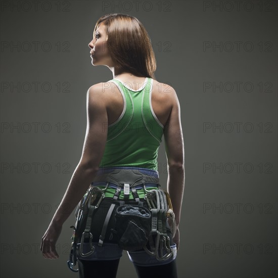 Back view of woman with climbing gear