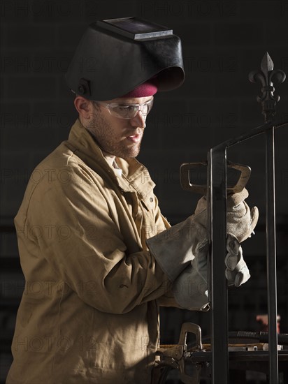 Steel grinder working in metal shop