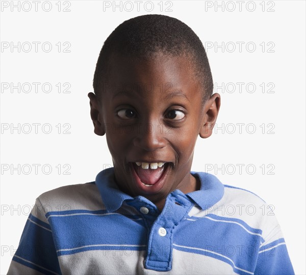 Portrait of boy making silly face