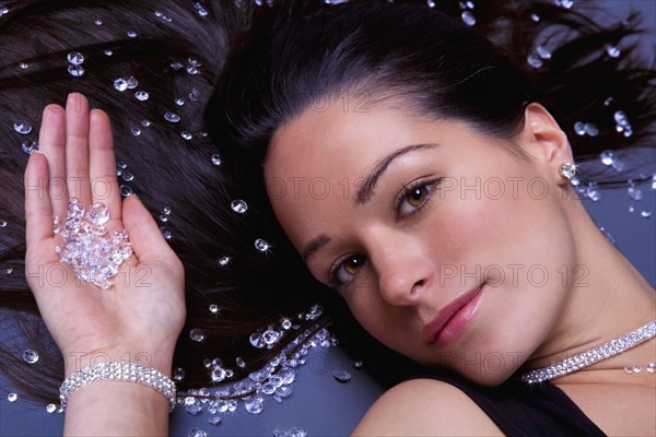 Woman lying down with diamonds