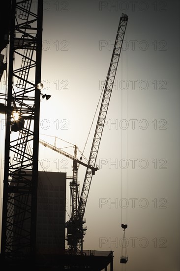 Cranes and high-rise building under construction