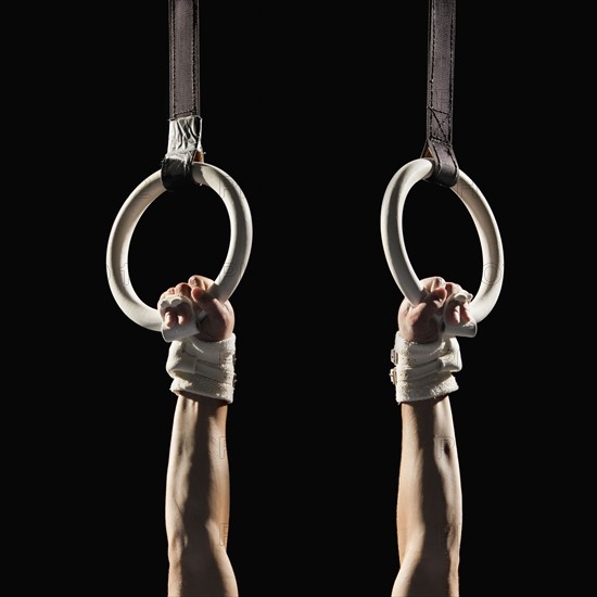 Gymnast swinging from rings