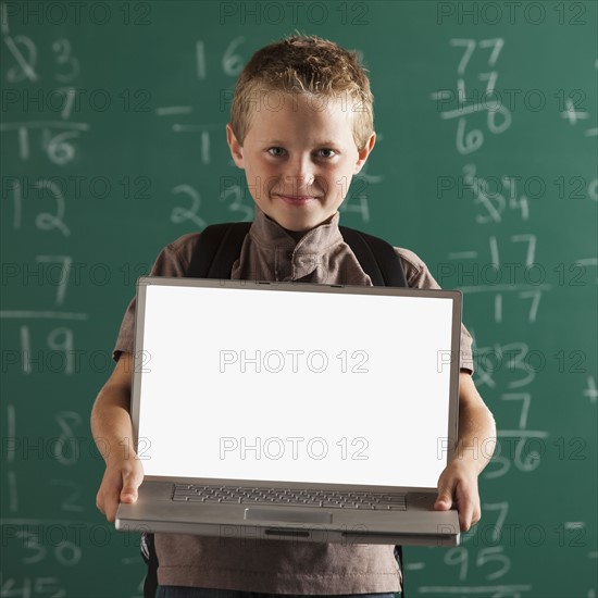 Student holding laptop