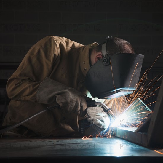 Steel worker in metal shop