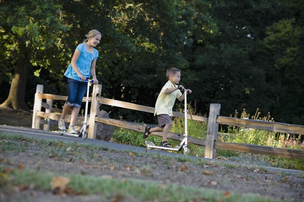 Children riding scooters